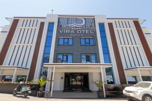 a view of a building with a car parked in front at Vira Otel Suites in Sinop