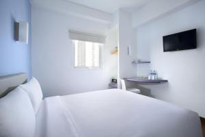 Cama o camas de una habitación en Amaris Hotel Cilegon