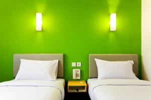 Letto o letti in una camera di Amaris Hotel Cilegon