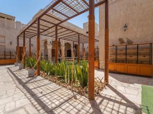 a greenhouse with plants in the middle of a building at Heritage Home Guest House in Dubai