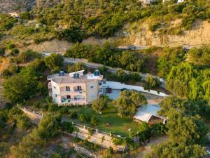 an aerial view of a house on a hill at OniRana Apartments in Borsh