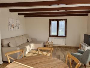 a living room with a couch and a table at La Quintana de Figares in Luarca