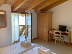 Postel nebo postele na pokoji v ubytování Agritur al Vigneto