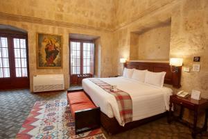 Casa Andina Premium Arequipa tesisinde bir odada yatak veya yataklar