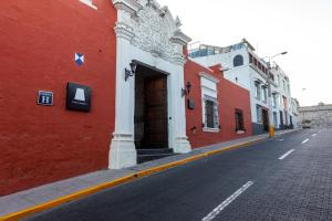 a brick building with a street sign on the side of it at Casa Andina Premium Arequipa in Arequipa