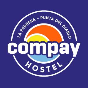 a logo for the comagency hostel at Compay Hostel La Pedrera in La Pedrera