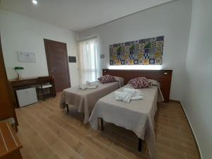 Postel nebo postele na pokoji v ubytování ZAHRA AGRITURISMO