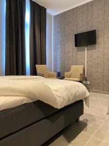 Postel nebo postele na pokoji v ubytování OLÉ Hotel