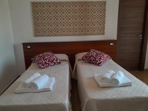 Postel nebo postele na pokoji v ubytování ZAHRA AGRITURISMO