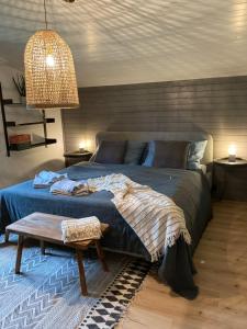 Posteľ alebo postele v izbe v ubytovaní DAS ERWIN Design-Bungalow (Nähe Velden/Wörthersee)