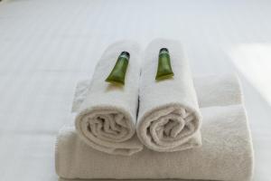 a towel with two champagne bottles on it at Nice house with a yard and common pool - Deauville - Welkeys in Deauville