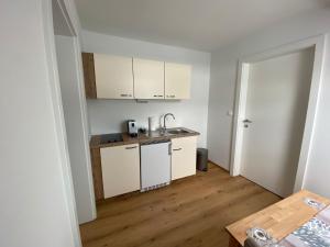 Kuchyň nebo kuchyňský kout v ubytování Private Zimmer HoAp