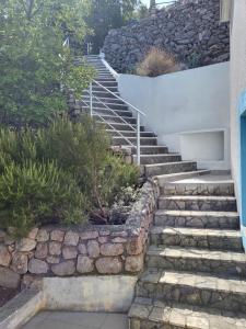 a set of stone stairs leading up to a house at Apartment Stipe in Donja Klada