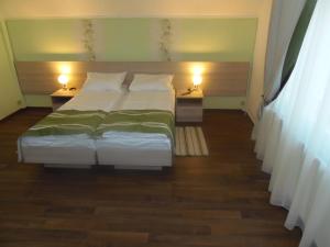 En eller flere senge i et værelse på Villa D'Hollande
