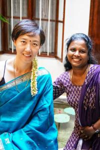 two women are standing next to each other at La Maison Pondichéry in Pondicherry