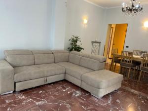 a living room with a couch and a table at SUNNY APARTMENT with big terrace in Rapallo