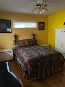 a bedroom with a bed and a ceiling fan at Beautiful Foothill Home in Rancho Cucamonga +18 photos