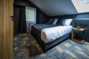 Posteľ alebo postele v izbe v ubytovaní 4 Évszak Erdeihotel**** - Mátrafüred