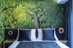 Posteľ alebo postele v izbe v ubytovaní 4 Évszak Erdeihotel**** - Mátrafüred