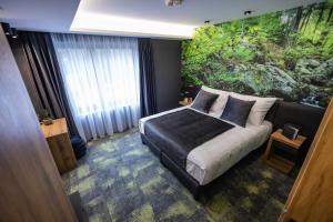 Posteľ alebo postele v izbe v ubytovaní 4 Évszak Erdeihotel**** - Mátrafüred