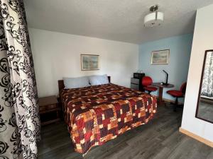 Säng eller sängar i ett rum på Liberty Motel