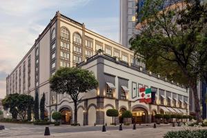 a large white building with flags on it at Four Seasons Hotel Mexico City in Mexico City