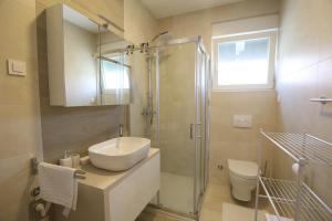 Koupelna v ubytování Smil'e Apartments + 6 fotografií