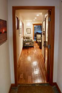 a hallway with a door open to a living room at Luxury 1 Bedroom Unit-Walk to Beach -Baby Friendly in Los Angeles