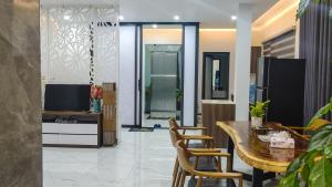 a dining room with a table and chairs at Green Line Long Bien - Serviced Apartment - Ngoc Thuy - Hanoi in Hanoi