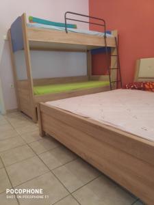 Postel nebo postele na pokoji v ubytování Κεντρικό, ανετο και ευρύχωρο διαμέρισμα