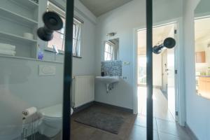 Koupelna v ubytování Vakantiewoningen Pomona + 22 fotografií