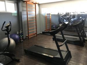 a gym with a treadmill and exercise equipment in it at Smart Residence flat 505 in Teresina