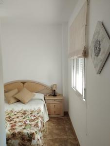 A bed or beds in a room at Nuevo Jerez