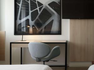 Rúm í herbergi á Radisson Blu Hotel, Hasselt