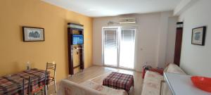 a living room with a couch and a table at Apartments Vela - Pestani, Ohrid in Ohrid