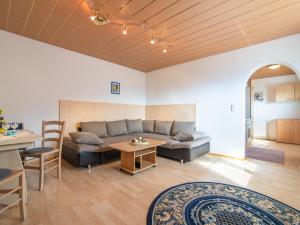 a living room with a couch and a table at Haus Sporer in Gerlosberg