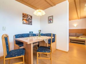 a kitchen and dining room with a table and chairs at Haus Rieder in Gerlosberg +17 photos