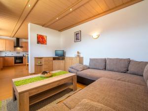 a living room with a couch and a table at Haus Rieder in Gerlosberg