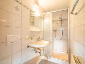 a bathroom with a sink and a shower at Chalet Blaserhof in Zell am Ziller