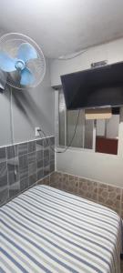 Voodi või voodid majutusasutuse Hostal Arica 3 toas