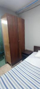 Voodi või voodid majutusasutuse Hostal Arica 3 toas