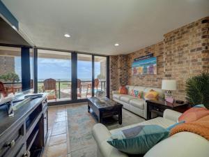 a living room with a couch and a table at Costa Crinks at Aransas Princess in Port Aransas