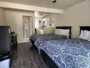 Cama ou camas em um quarto em Plainview Motel