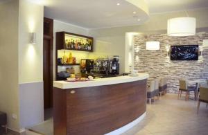 a bar in a restaurant with a brick wall at Hotel Margherita in Scanno