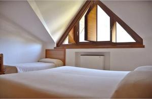 Łóżko lub łóżka w pokoju w obiekcie Hotel Margherita