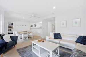 a living room with a couch and a table at Eastpoint 3 in Byron Bay