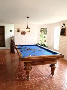 a pool table in the middle of a room at casa calima in Calima