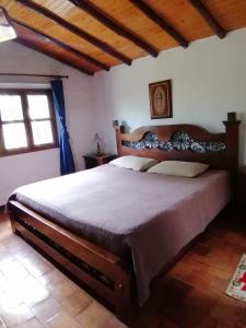 a bedroom with a large bed in a room at casa calima in Calima