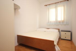 Posteľ alebo postele v izbe v ubytovaní Apartment Vis 2470a
