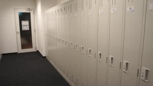 a row of lockers in a locker room at Men Only Capsule Room & Sauna, Bathhouse 男性専用サウナ&カプセル Minami Roppongi in Tokyo